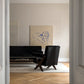 Modern living room with black sofa and chair, artwork on the wall. Presence 3 – Figurative Abstract Canvas | Premium Wall Art | Brume Art | Luxury Wall Decor | Large Canvas Wall Art | Oversized Wall Hanging-Brume art