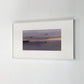Framed photograph of birds flying over water at sunset on a white wall. Away – Minimalist Abstract Canvas Art | Large Luxury Wall Decor | Brume Art