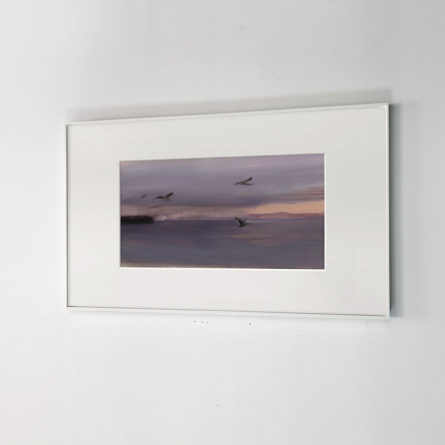 Framed photograph of birds flying over water at sunset on a white wall. Away – Minimalist Abstract Canvas Art | Large Luxury Wall Decor | Brume Art