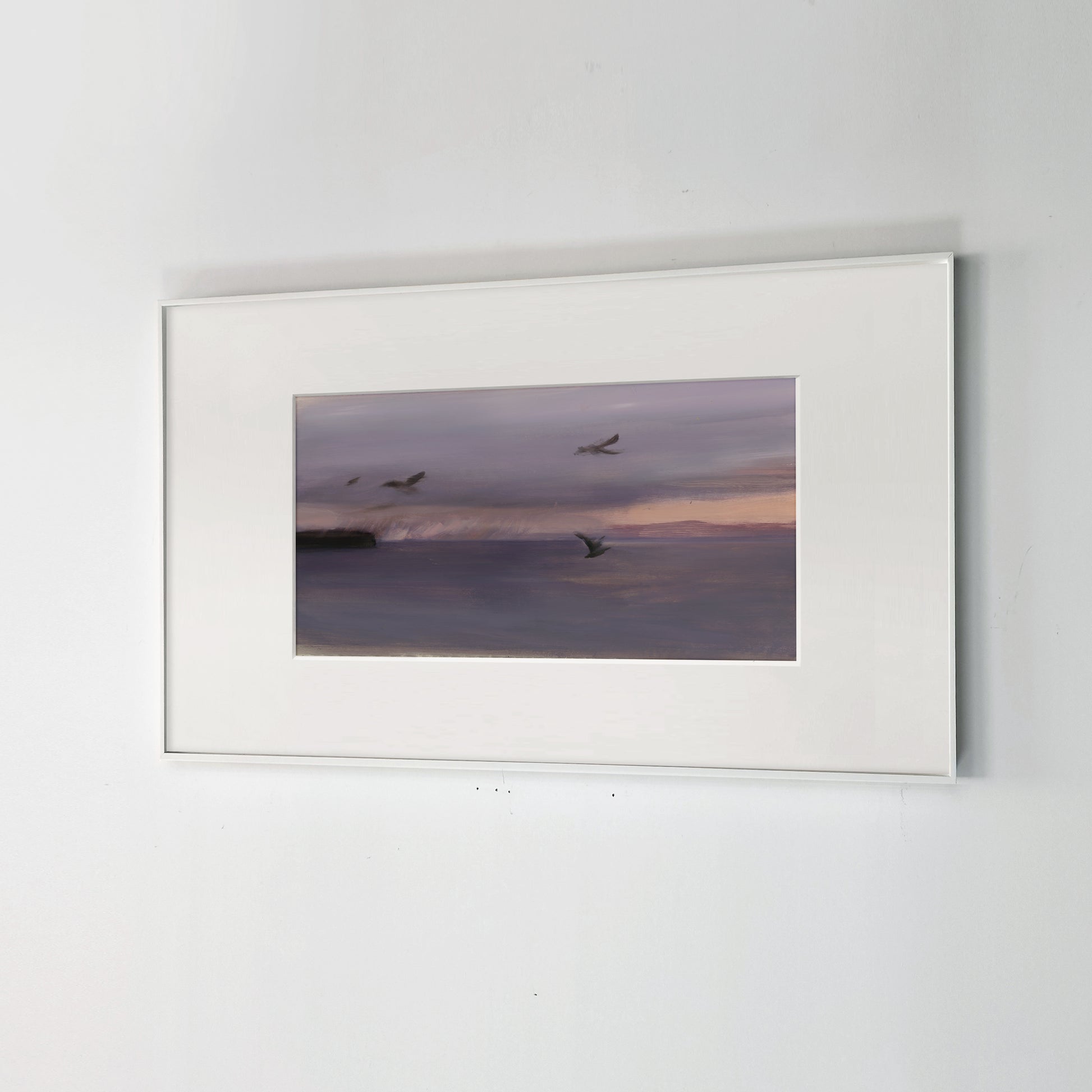 Framed photograph of birds flying over water at sunset on a white wall. Away – Minimalist Abstract Canvas Art | Large Luxury Wall Decor | Brume Art
