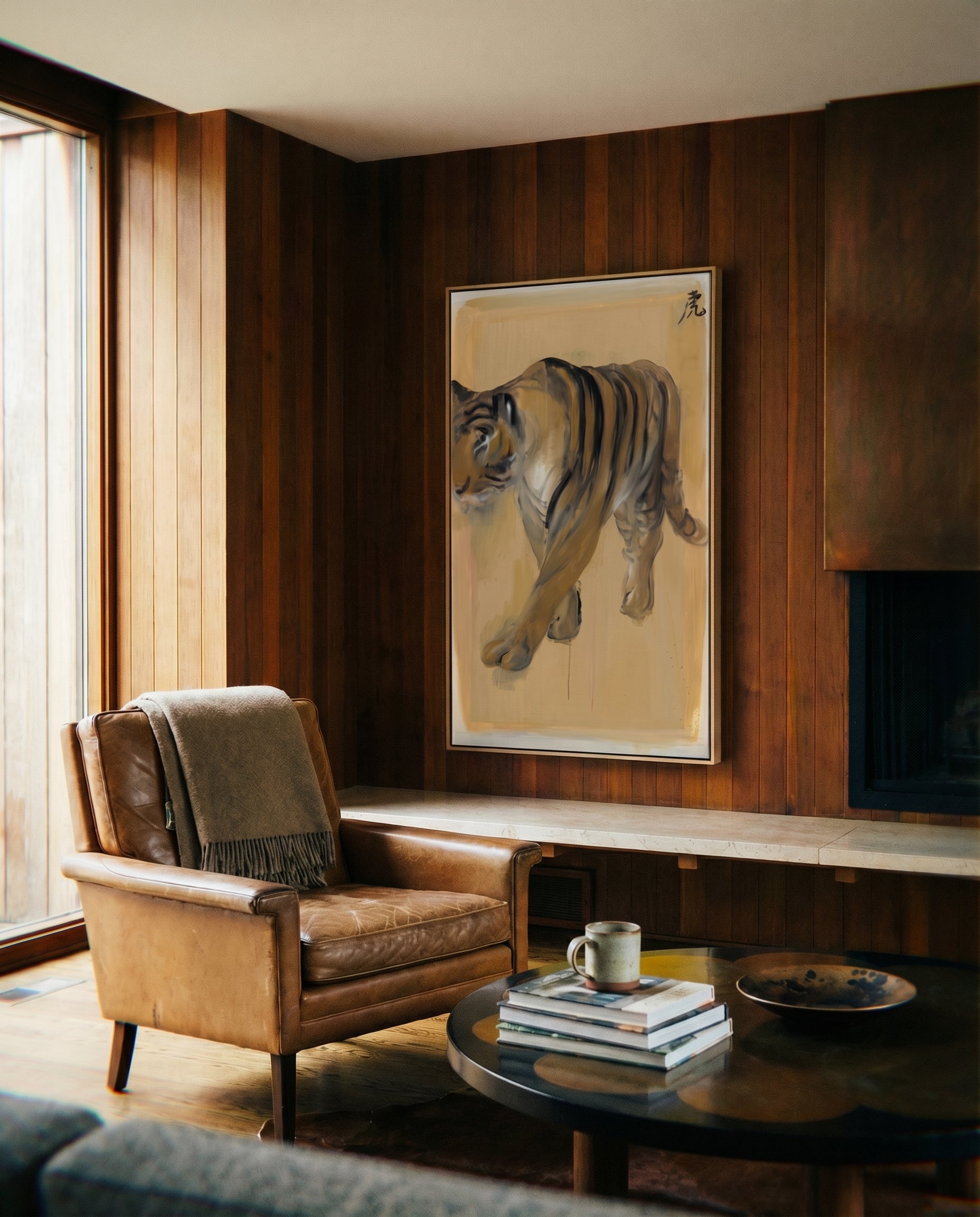 Living room with a brown leather armchair, coffee table, and tiger painting on wooden wall. Tiger – Contemporary Animal Canvas Art | Luxury Wall Decor | Brume Art