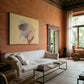 Living room with a white sofa, wooden coffee table, and a large painting on an orange wall. Soft Body – Figurative Abstract Canvas Print | Premium Wall Art | Brume Art