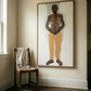 Framed portrait of a shirtless man wearing yellow pants in a room with a wooden chair and white towel. Fisherman of manila-Figurative Canvas Wall Art | Premium Luxury Print | Brume Art