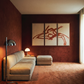 Modern living room with a beige sectional sofa, floor lamp, and abstract wall art.