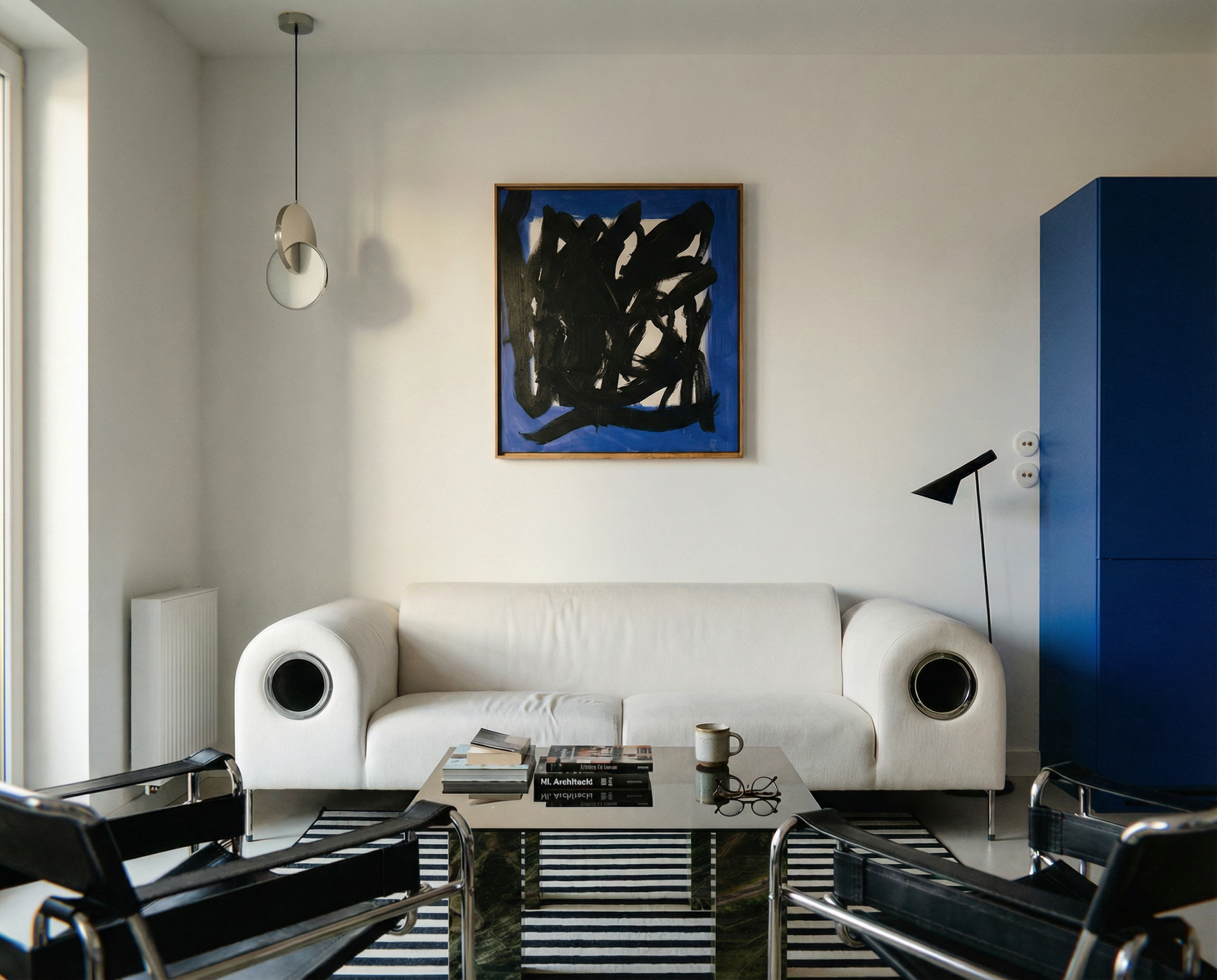 Modern living room with white sofa, abstract art, and striped rug. Noise 5 – Bold Abstract Canvas Print | Large Luxury Wall Art | Brume Art