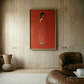 Living room with wooden walls, a brown armchair, and a red painting of a woman. The Woman in Red – Portrait Canvas Wall Art | Large Luxury Print | Brume Art