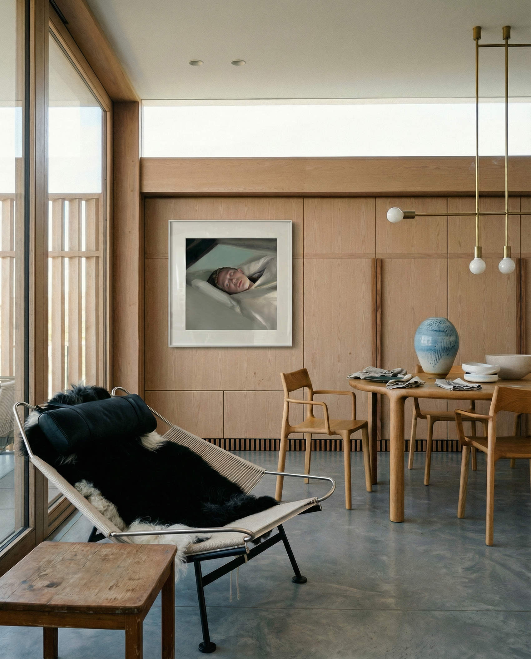 Modern interior with a lounge chair, dining table, and artwork on a wall. Gaze – Figurative Canvas Wall Art | Premium Luxury Print | Brume Art | Luxury Wall Decor | Large Canvas Wall Art | Oversized Wall Hanging-Brume art