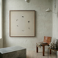 Modern interior with a framed artwork of birds on a neutral wall, a brown chair, and a concrete bench.  Birds – Nature Canvas Wall Art | Large Luxury Print | Brume Art