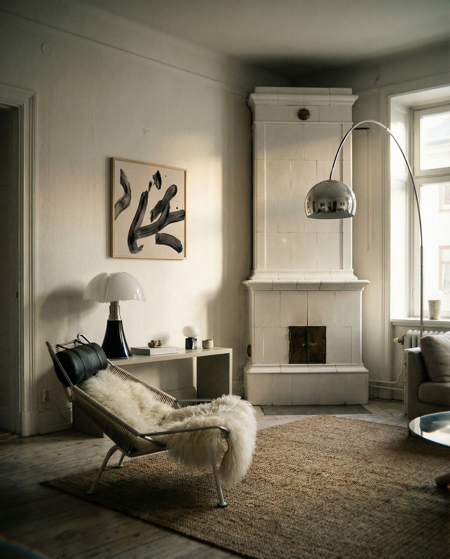 Modern living room with a fireplace, chair, and abstract art on the wall. Ink 3 – Abstract Ink Canvas Wall Art | Oversized Luxury Print | Brume Art | Luxury Wall Decor | Large Canvas Wall Art | Oversized Wall Hanging-Brume art