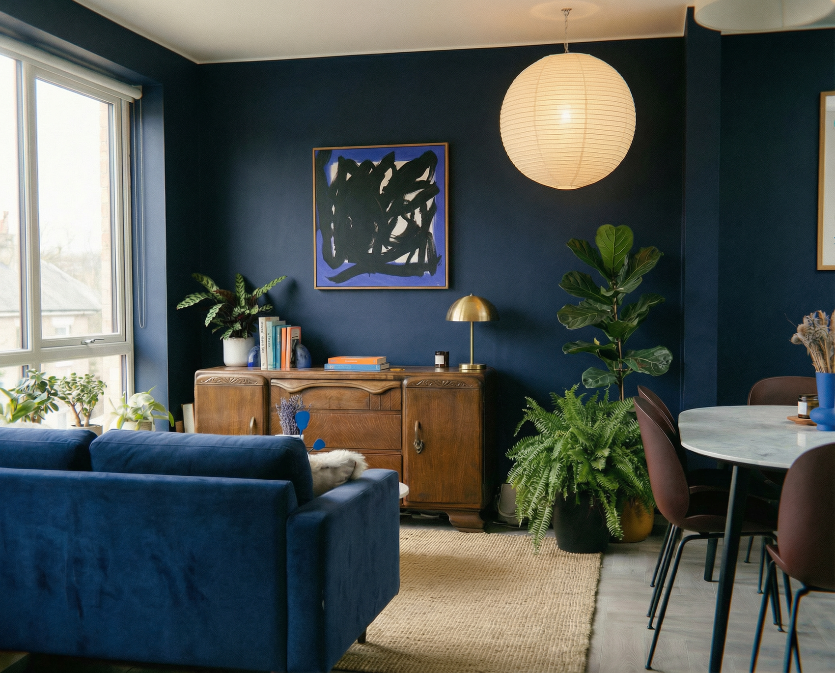 Living room with blue walls, a blue sofa, and a wooden sideboard. Noise 5 – Bold Abstract Canvas Print | Large Luxury Wall Art | Brume Art