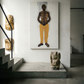 Staircase with a large painting of a shirtless man in yellow pants and two stone sculptures on a platform. Fisherman of manila-Figurative Canvas Wall Art | Premium Luxury Print | Brume Art