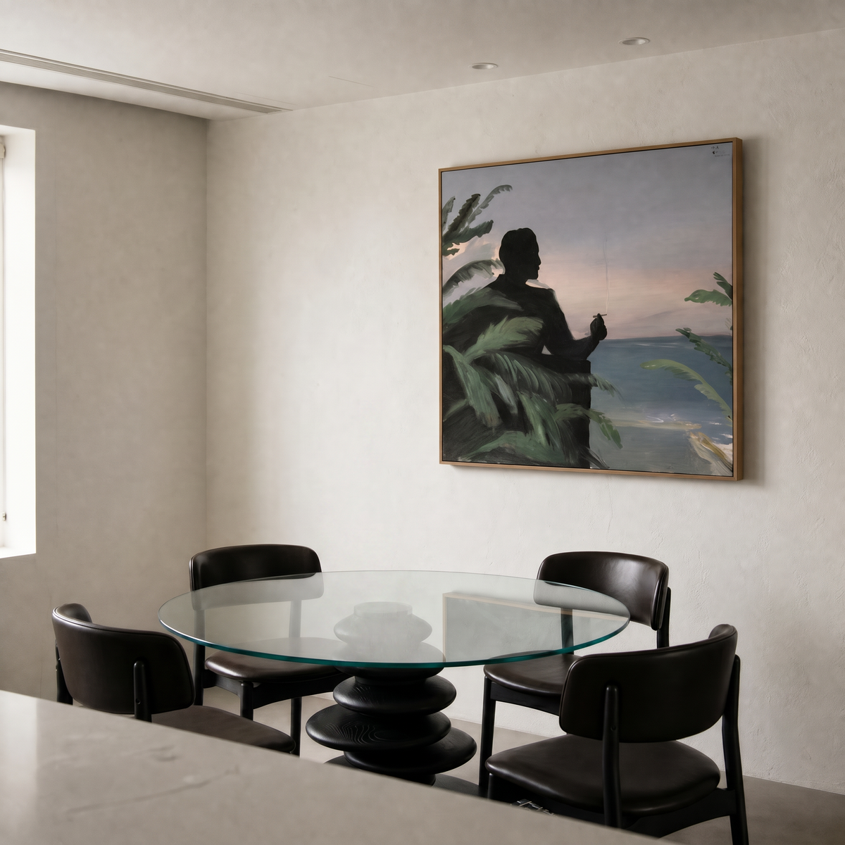 Dining room with a glass table and black chairs, featuring a large framed painting on the wall.