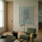 Modern interior with a green armchair, round table, and abstract art on the wall. tension 3 – Textured Abstract Canvas Art | Premium Luxury Wall Decor | Brume Art