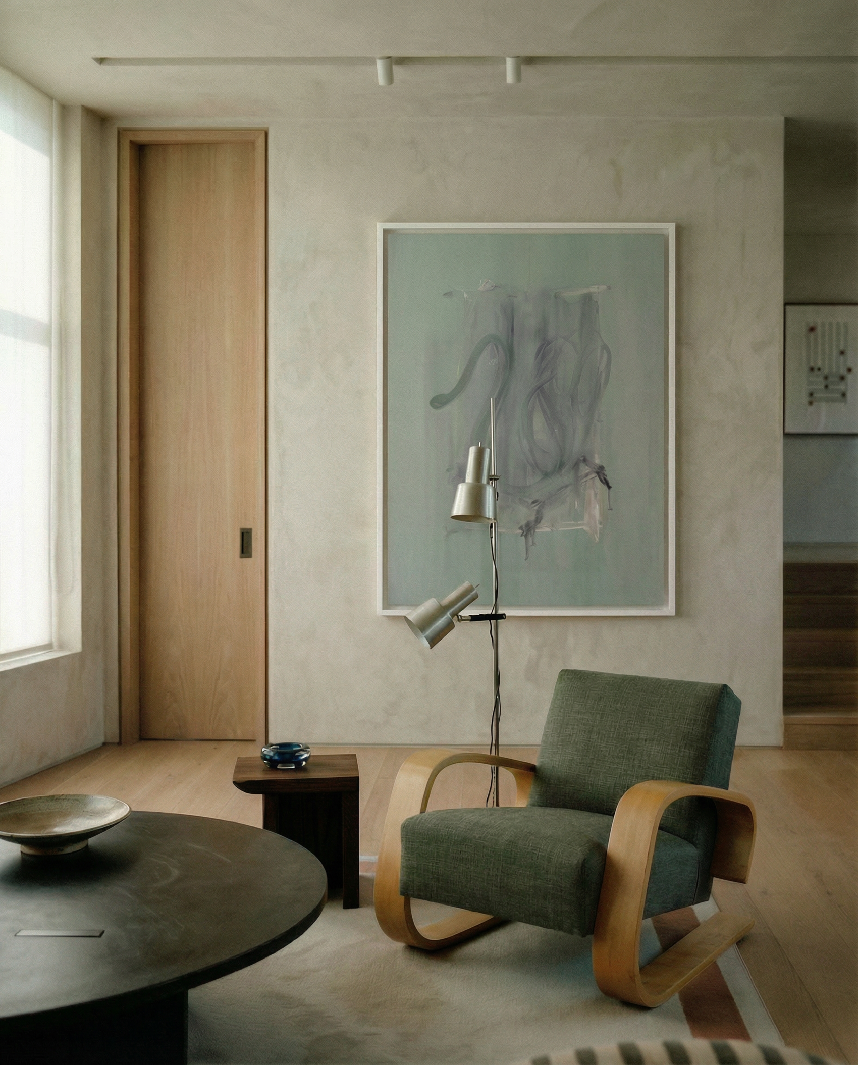 Modern interior with a green armchair, round table, and abstract art on the wall. tension 3 – Textured Abstract Canvas Art | Premium Luxury Wall Decor | Brume Art