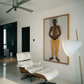 Modern interior with a white lounge chair, ceiling fan, and artwork on the wall. Fisherman of manila-Figurative Canvas Wall Art | Premium Luxury Print | Brume Art | Luxury Wall Decor | Large Canvas Wall Art | Oversized Wall Hanging-Brume art
