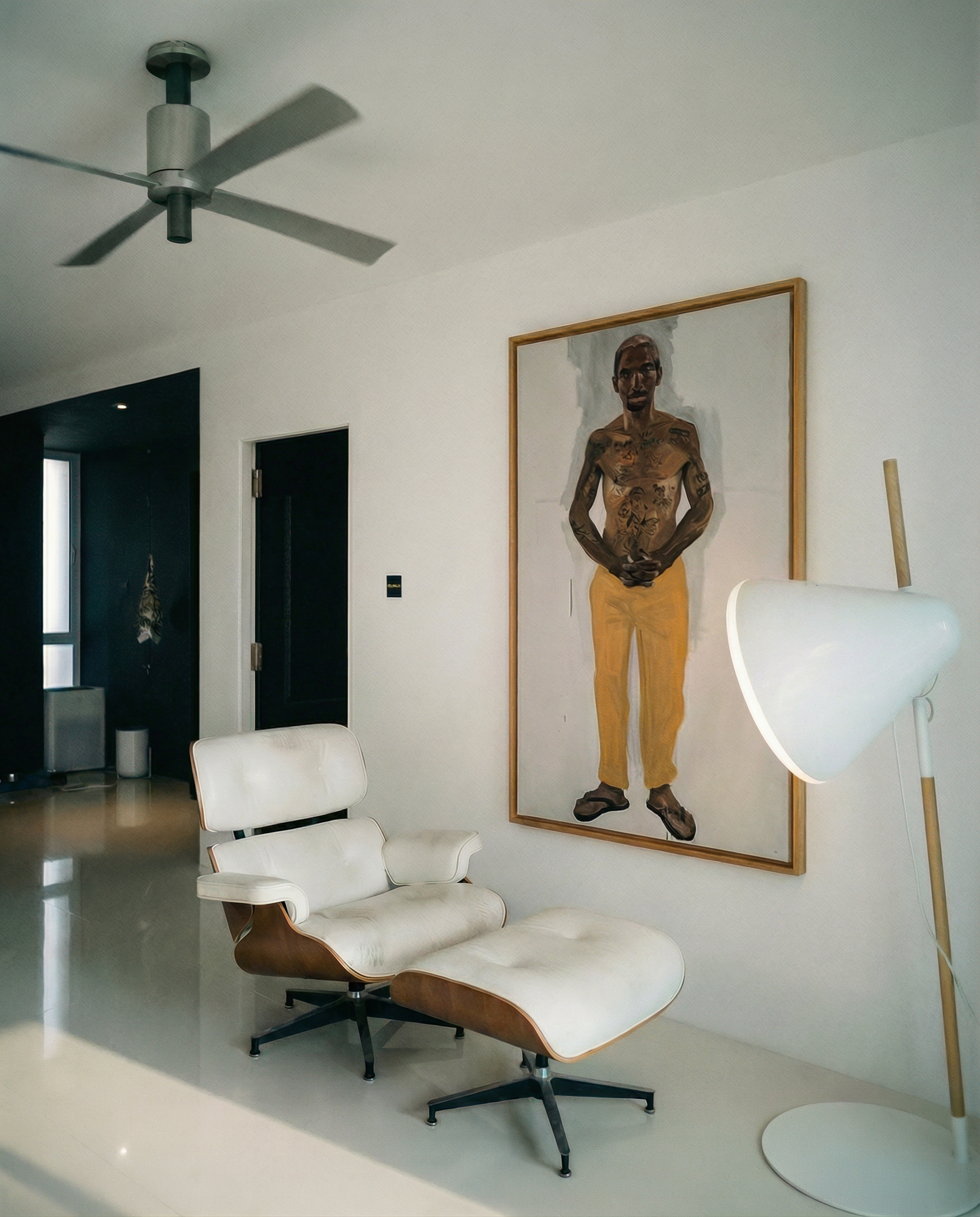 Modern interior with a white lounge chair, ceiling fan, and artwork on the wall. Fisherman of manila-Figurative Canvas Wall Art | Premium Luxury Print | Brume Art | Luxury Wall Decor | Large Canvas Wall Art | Oversized Wall Hanging-Brume art