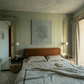Modern bedroom with a bed, nightstands, and wall art. tension 3 – Textured Abstract Canvas Art | Premium Luxury Wall Decor | Brume Art